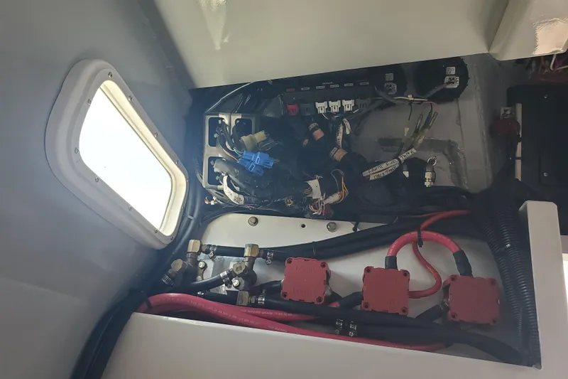 Slide: The Image of Electrical wiring and components inside a 1989 Boston Whaler Challenger boat. - 19