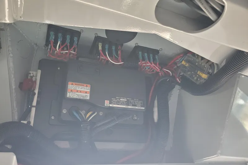 Slide: The Image of Electrical wiring and components inside a 1989 Boston Whaler Challenger boat. - 20