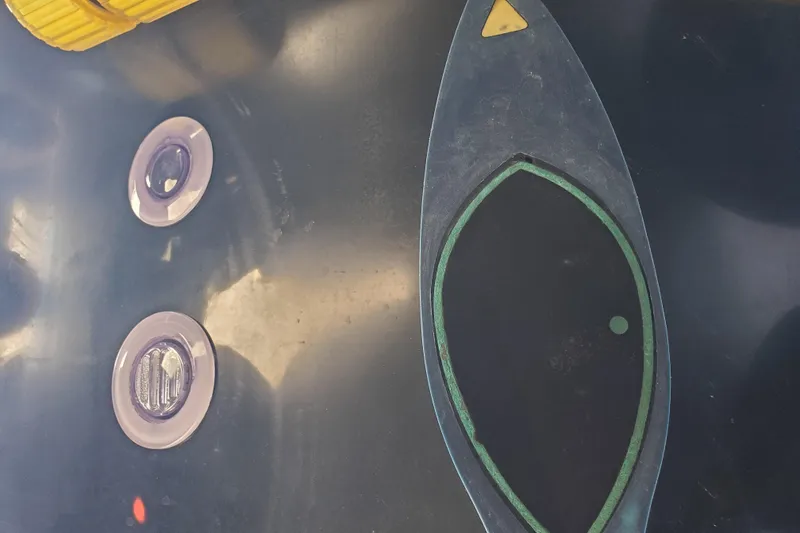 Slide: The Image of 1989 Boston Whaler Challenger boat dashboard with controls and indicators. - 32