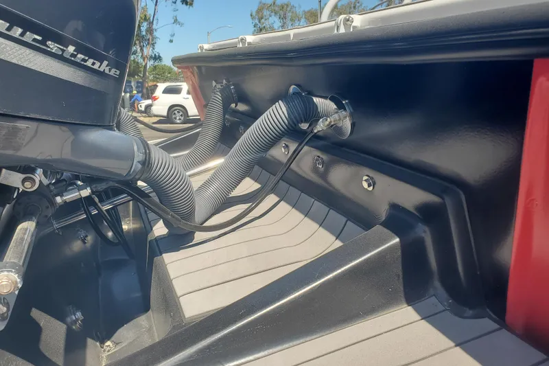 Slide: The Image of 1989 Boston Whaler Challenger boat interior with engine and wiring details. - 9
