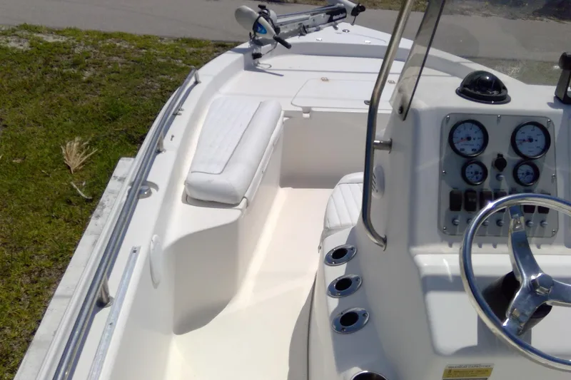 Slide: The Image of 2007 Tidewater 216 CC Adventure boat interior with steering console and seating. - 18