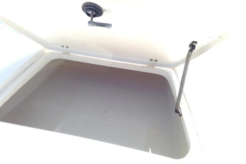 Slide: The Image of Open storage compartment on a 2007 Tidewater 216 CC Adventure boat. - 21