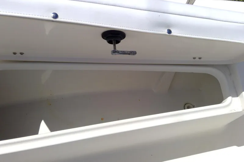 Slide: The Image of Open storage compartment on a 2007 Tidewater 216 CC Adventure boat. - 23