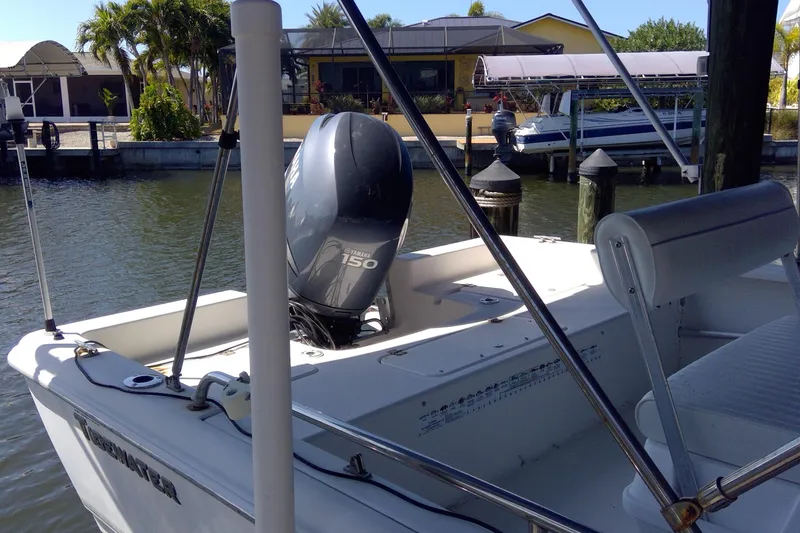 Slide: The Image of 2007 Tidewater 216 CC Adventure boat with Yamaha 150 engine docked by waterfront. - 3