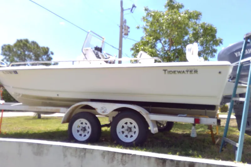 Slide: The Image of 2007 Tidewater 216 CC Adventure boat on trailer, parked outdoors. - 35