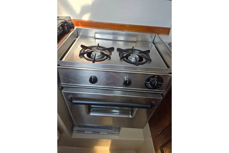 Slide: The Image of Stainless steel stove and oven in 1988 Catalina 30 MkIII yacht kitchen. - 2