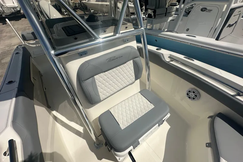 Slide: The Image of 2026 Pioneer 202 Sportfish boat interior with cushioned seating and stainless steel frame. - 7
