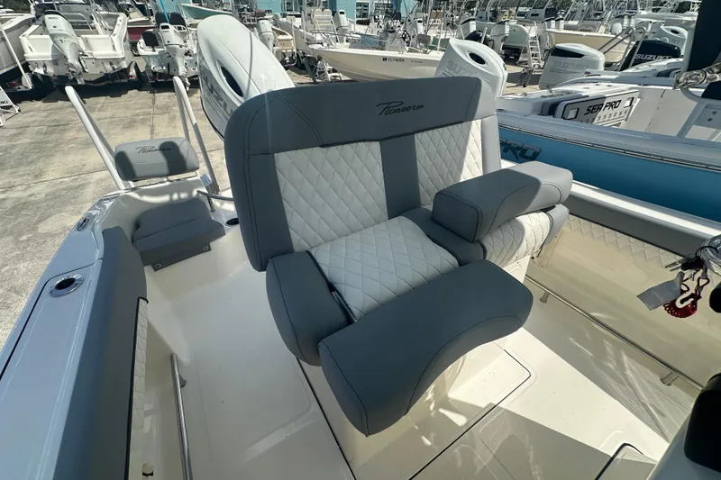 Slide: The Image of 2026 Pioneer 202 Sportfish boat with luxurious seating and modern design. - 9