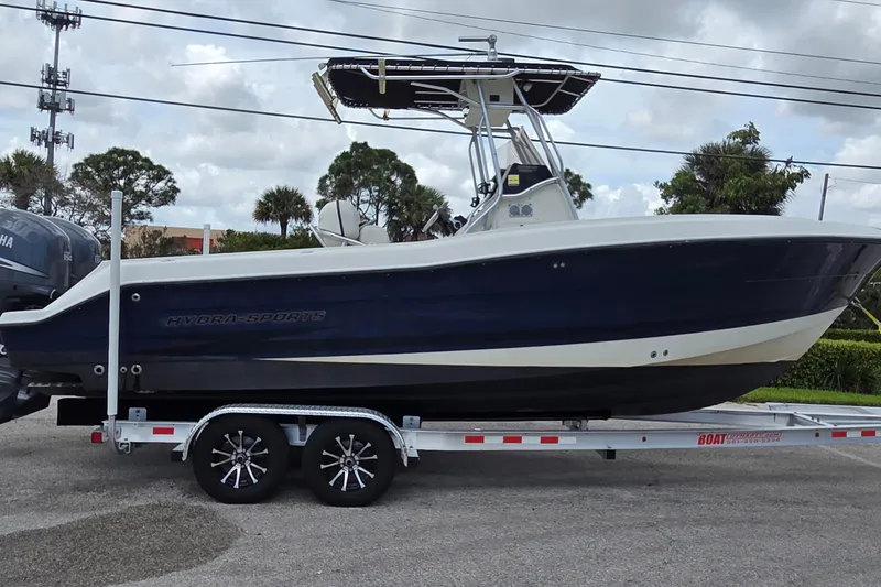 The Image of 2004 Hydra-Sports Vector 2400 CC boat on trailer, parked outdoors. - 0