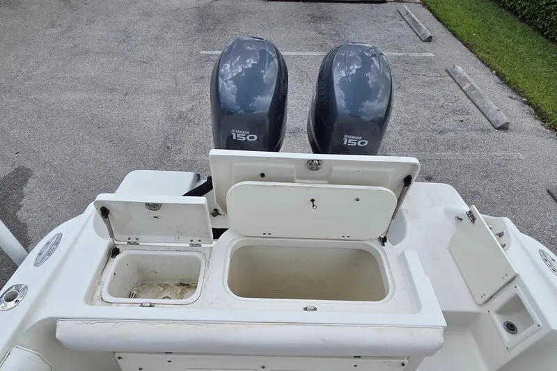 Slide: The Image of 2004 Hydra-Sports Vector 2400 CC with dual Yamaha 150 engines and open storage compartments. - 12