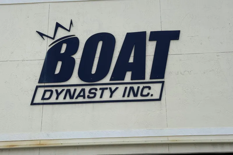 Slide: The Image of Sign for Boat Dynasty Inc. on a textured wall, related to Hydra-Sports Vector 2400 CC, 2004. - 18