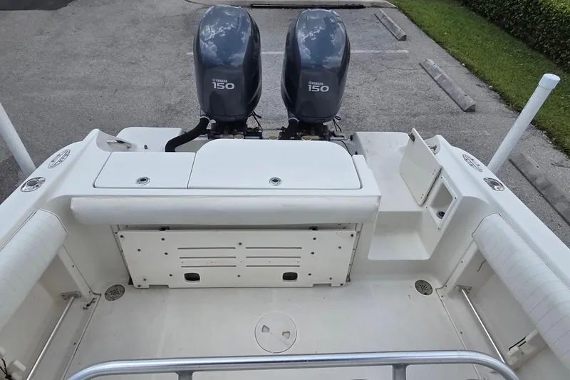 Slide: The Image of 2004 Hydra-Sports Vector 2400 CC boat with twin Yamaha 150 engines, parked on pavement. - 3