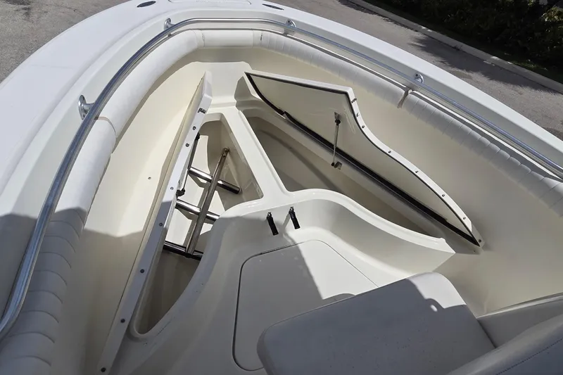 Slide: The Image of 2004 Hydra-Sports Vector 2400 CC boat interior with open storage compartment. - 4