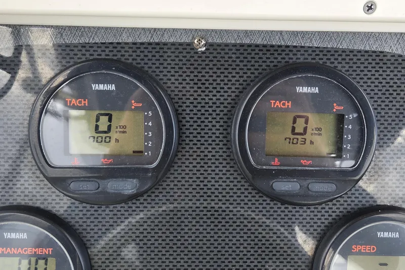 Slide: The Image of Yamaha tachometers on 2004 Hydra-Sports Vector 2400 CC boat dashboard, displaying engine hours. - 6