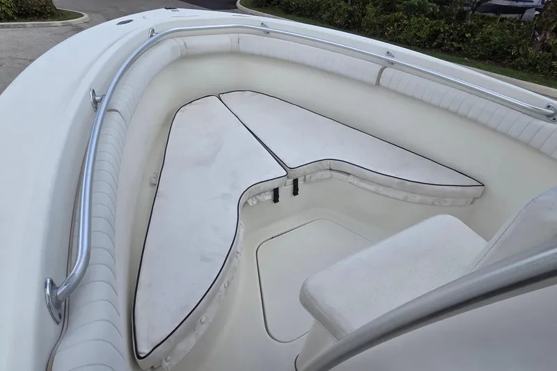 Slide: The Image of 2004 Hydra-Sports Vector 2400 CC boat interior with cushioned seating and stainless steel railing. - 7