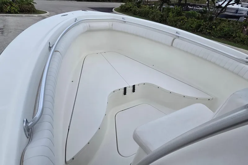 Slide: The Image of 2004 Hydra-Sports Vector 2400 CC boat interior with white seating and railings. - 8