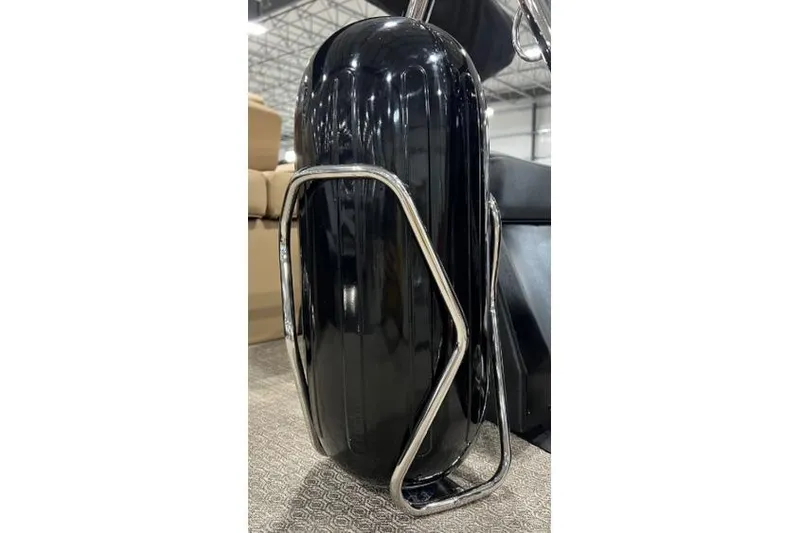 Slide: The Image of Black Evotti 523QL 2026 motorcycle fender with chrome detailing in a showroom. - 8