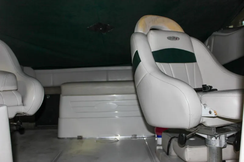 Slide: The Image of Interior of a 2000 Chaparral 245 SSi boat with white seating. - 11