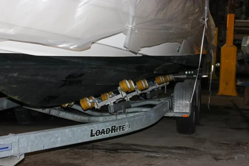 Slide: The Image of Chaparral 245 SSi 2000 boat on Load Rite trailer in storage. - 15