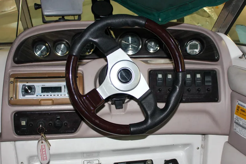 Slide: The Image of Steering wheel and dashboard of a 2000 Chaparral 245 SSi boat. - 3