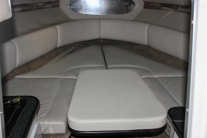 Slide: The Image of Interior cabin of 2000 Chaparral 245 SSi boat with cushioned seating. - 4