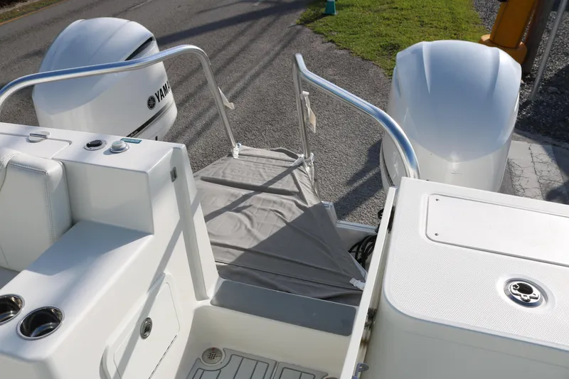 Slide: The Image of 2019 World Cat 320 DC boat with Yamaha engines, rear deck view. - 16