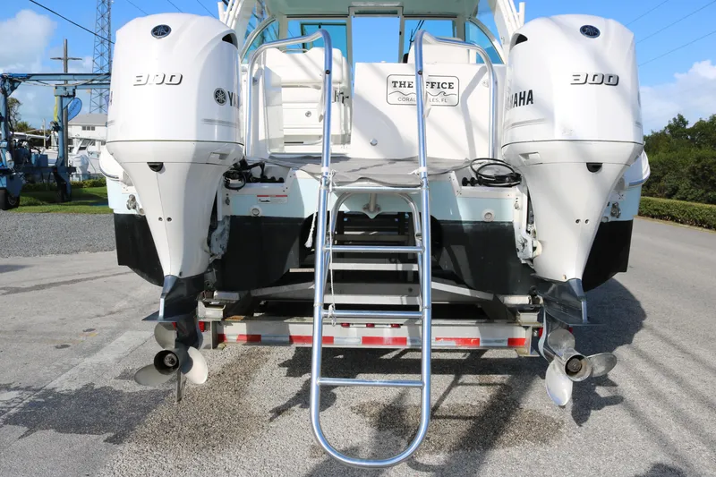 Slide: The Image of 2019 World Cat 320 DC boat with dual Yamaha 300 engines and ladder. - 5