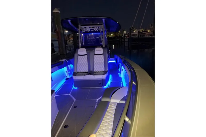 Slide: The Image of 2019 Statement 380 Open boat with blue LED lighting at night. - 11