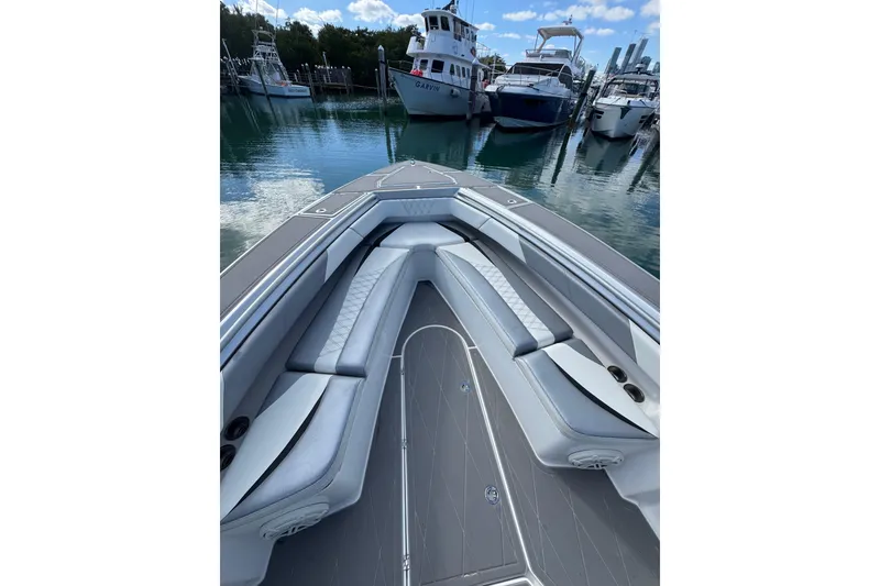 Slide: The Image of 2019 Statement 380 Open boat with sleek seating, docked on a sunny day. - 3