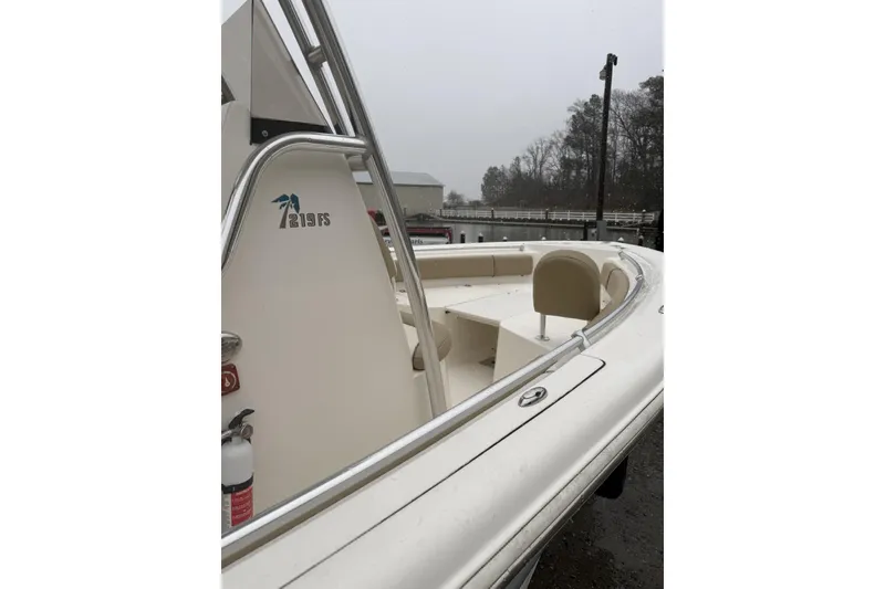 Slide: The Image of 2019 Key West 219 FS boat, white interior, docked on a cloudy day. - 6
