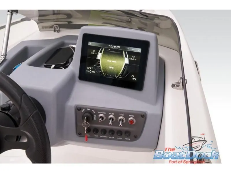Slide: The Image of 2023 Tahoe T16 boat console with controls and display. - 45