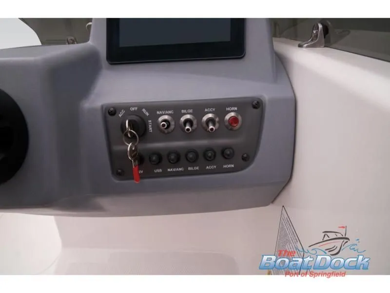 Slide: The Image of Dashboard of 2023 Tahoe T16 boat with switches and ignition key. - 48