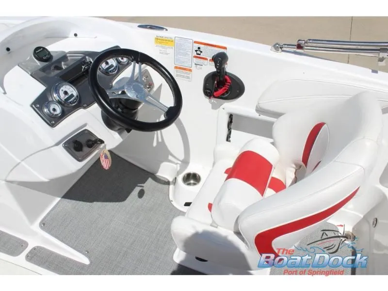 Slide: The Image of Interior of a 2022 Tahoe 2150 boat with steering and seat. - 11