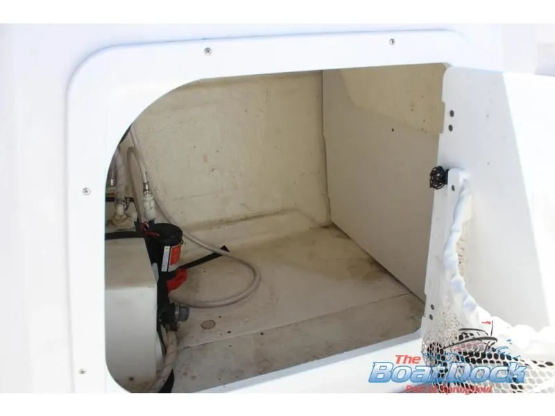 Slide: The Image of Interior of 2022 Tahoe 2150 boat, storage compartment view. - 17
