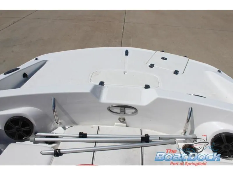 Slide: The Image of 2022 Tahoe 2150 boat deck with speakers and storage compartments. - 23