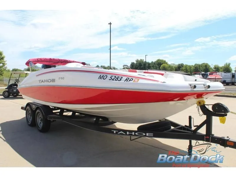 Slide: The Image of 2022 Tahoe 2150 boat on trailer outdoors. - 4