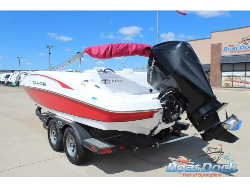 Slide: The Image of 2022 Tahoe 2150 boat on trailer at dock. - 8
