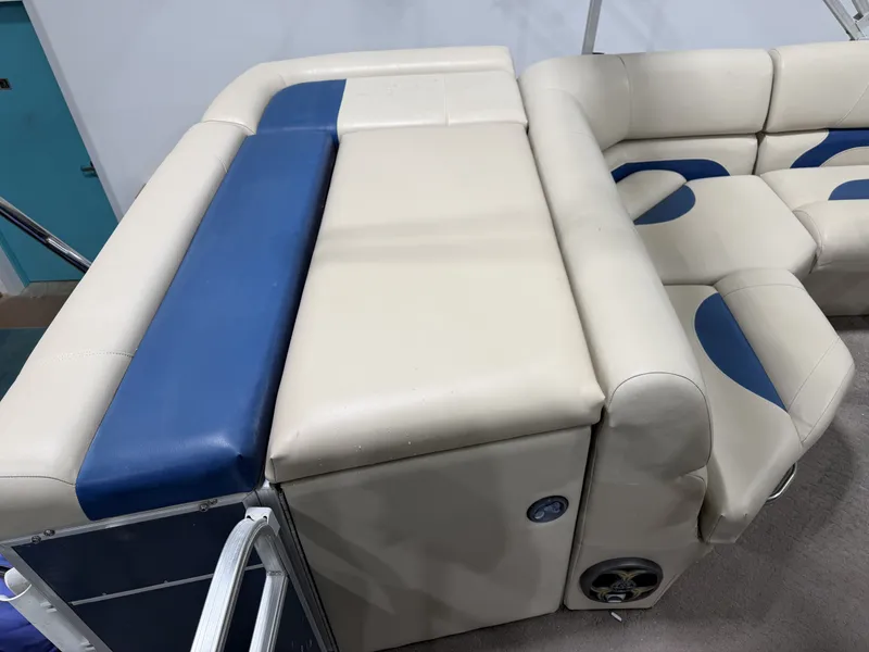 Slide: The Image of Lowe SS 210 2014 boat seating with blue and beige upholstery. - 17