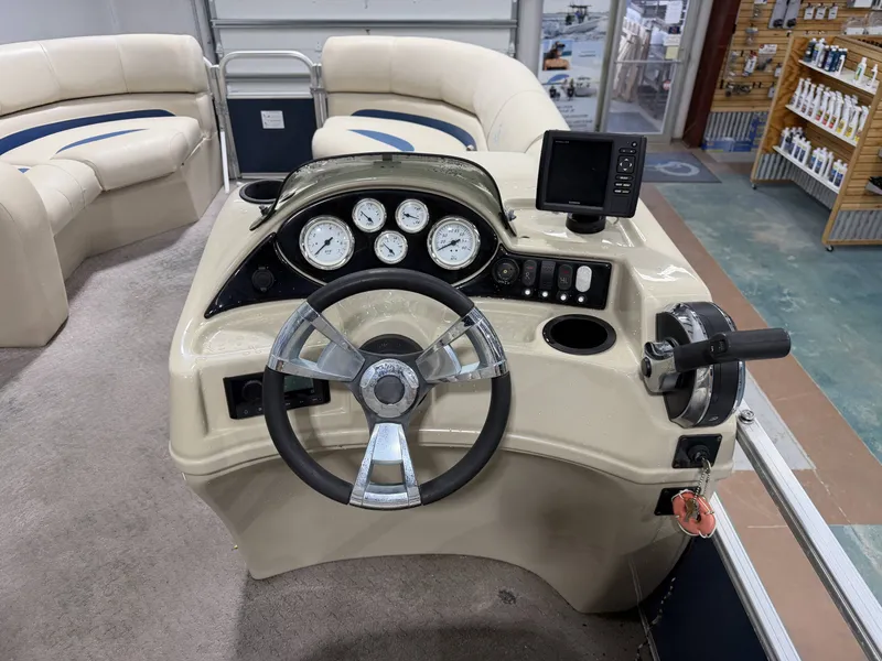 Slide: The Image of Steering console of a 2014 Lowe SS 210 pontoon boat. - 9