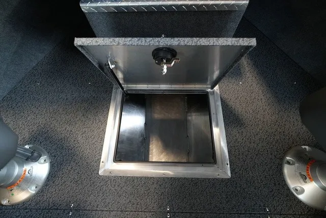 Slide: The Image of Lund 185 Heavy Gauge Sport 2027: Open storage compartment in carpeted boat floor. - 35