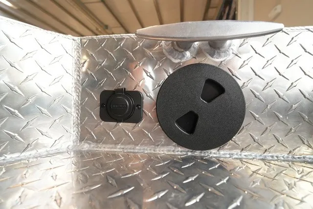 Slide: The Image of Close-up of an aluminum boat deck with non-slip diamond plating and two round fittings. - 38