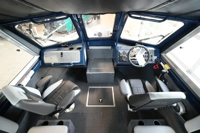 Slide: The Image of Interior of a 2027 Lund 185 Heavy Gauge Sport boat with two seats and a helm station. - 27