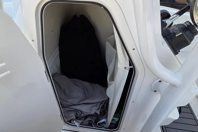 Slide: The Image of Storage compartment in 2023 Key West 219 FS boat, featuring interior items and equipment. - 17