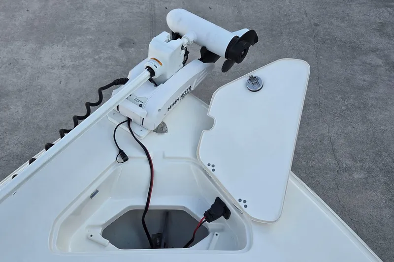 Slide: The Image of 2023 Key West 219 FS boat with Minn Kota trolling motor on deck. - 18