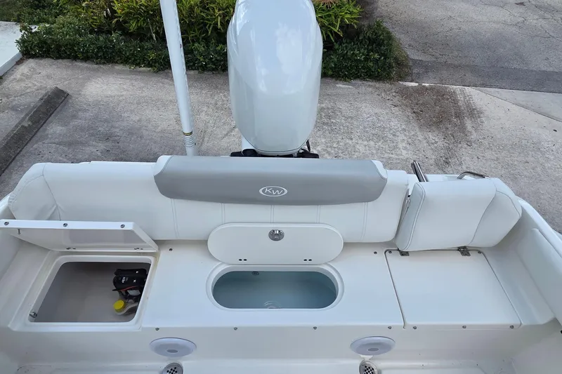 Slide: The Image of 2023 Key West 219 FS boat interior with seating and storage compartments. - 20