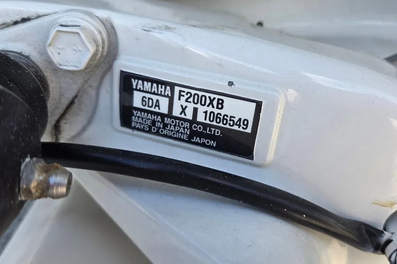 Slide: The Image of Yamaha F200XB engine label on 2023 Key West 219 FS boat, made in Japan. - 23
