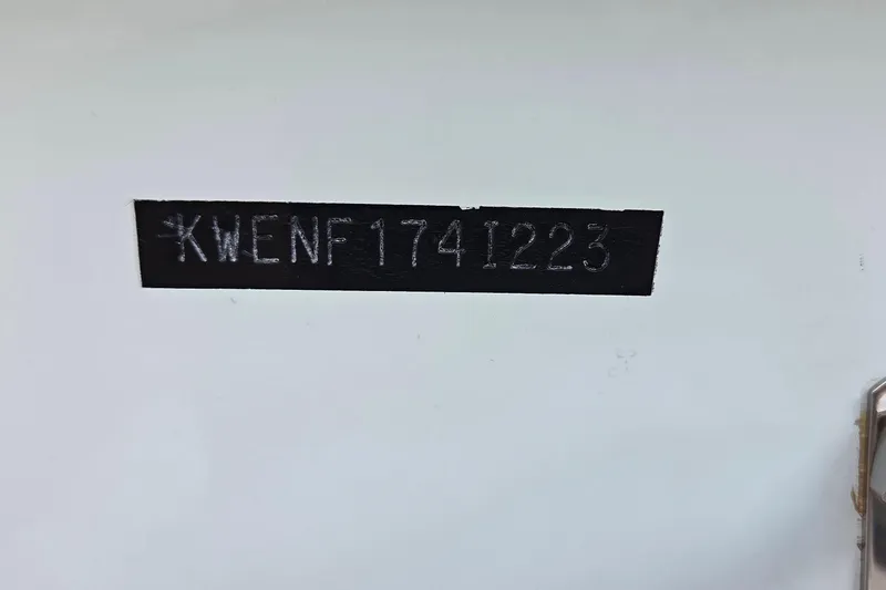 Slide: The Image of 2023 Key West 219 FS boat hull identification number on white surface. - 25