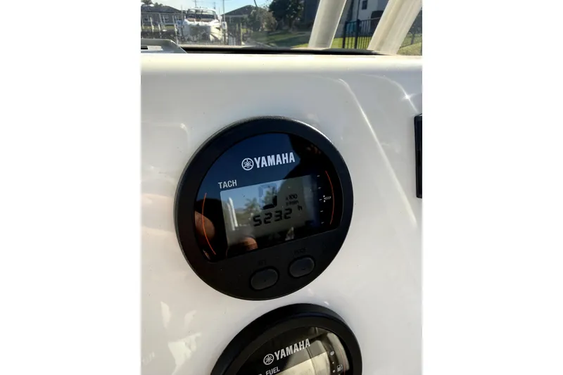 Slide: The Image of Yamaha tachometer on 2023 Key West 219 FS boat dashboard. - 4