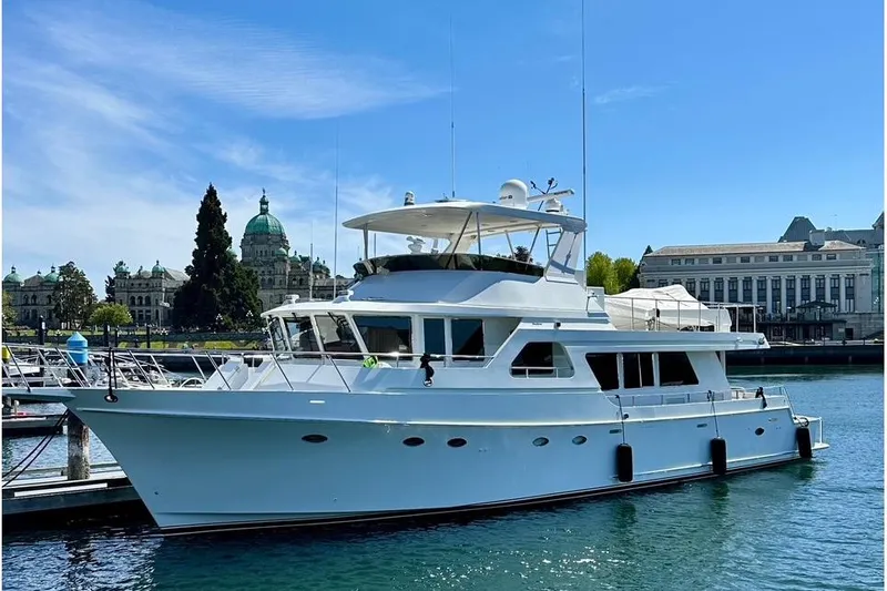 Slide: The Image of Luxury 2003 Ocean Alexander 700 Classicco yacht docked in scenic harbor. - 13