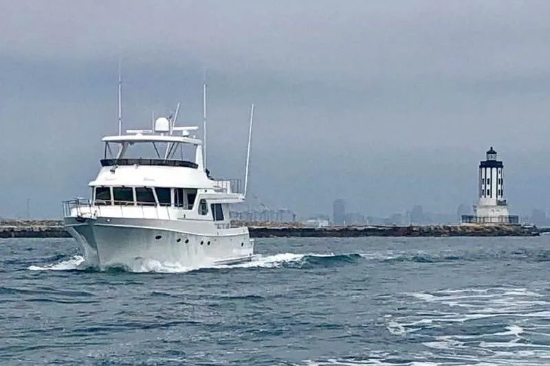 Slide: The Image of Ocean Alexander 700 Classicco yacht cruising near a lighthouse, 2003 model. - 14